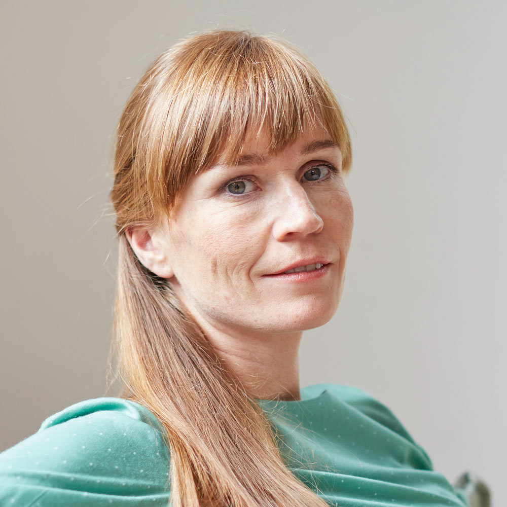 portrait-of-red-haired-mid-adult-woman-looking-at-2022-03-04-01-55-05-utc.jpg
